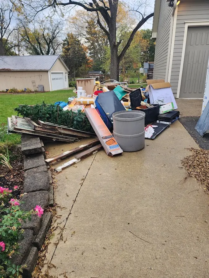Dumpster being loaded with debris for 10 Yard Dumpster Rental in Menlo Park